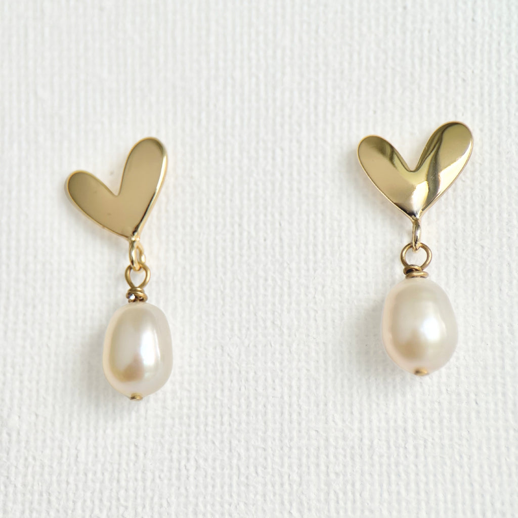 Natural Pearl Heart Stud Earrings featuring natural pearl and gold-plated brass, silver ear pins by Toronto-based Meng Jewellery
