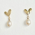 Natural Pearl Heart Stud Earrings featuring natural pearl and gold-plated brass, silver ear pins by Toronto-based Meng Jewellery