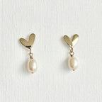 Natural Pearl Heart Stud Earrings featuring natural pearl and gold-plated brass, silver ear pins by Toronto-based Meng Jewellery