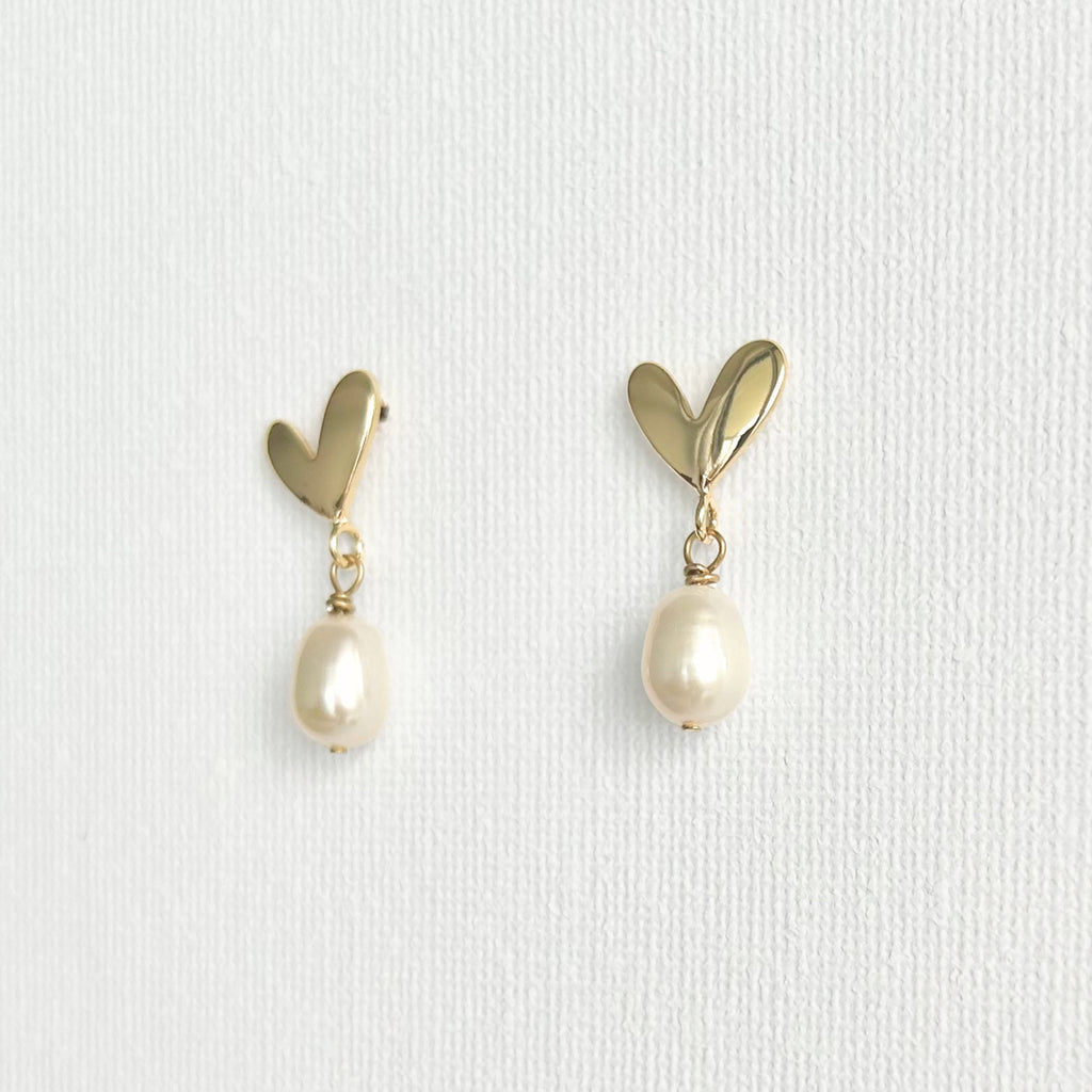 Natural Pearl Heart Stud Earrings featuring natural pearl and gold-plated brass, silver ear pins by Toronto-based Meng Jewellery