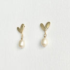 Natural Pearl Heart Stud Earrings featuring natural pearl and gold-plated brass, silver ear pins by Toronto-based Meng Jewellery