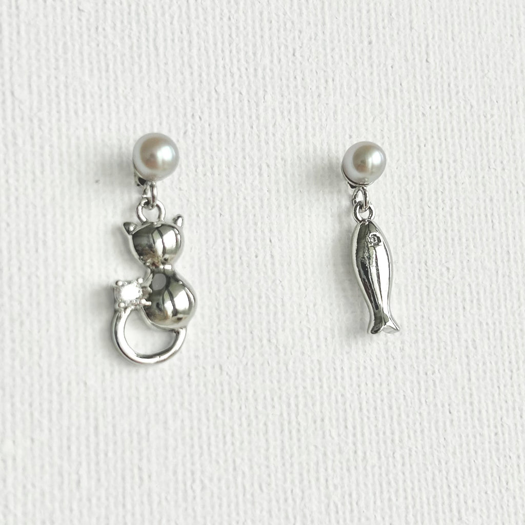 Natural Pearl Fish & Cat Stud Earrings featuring natural pearl and gold-plated brass, silver ear pins by Toronto-based Meng Jewellery