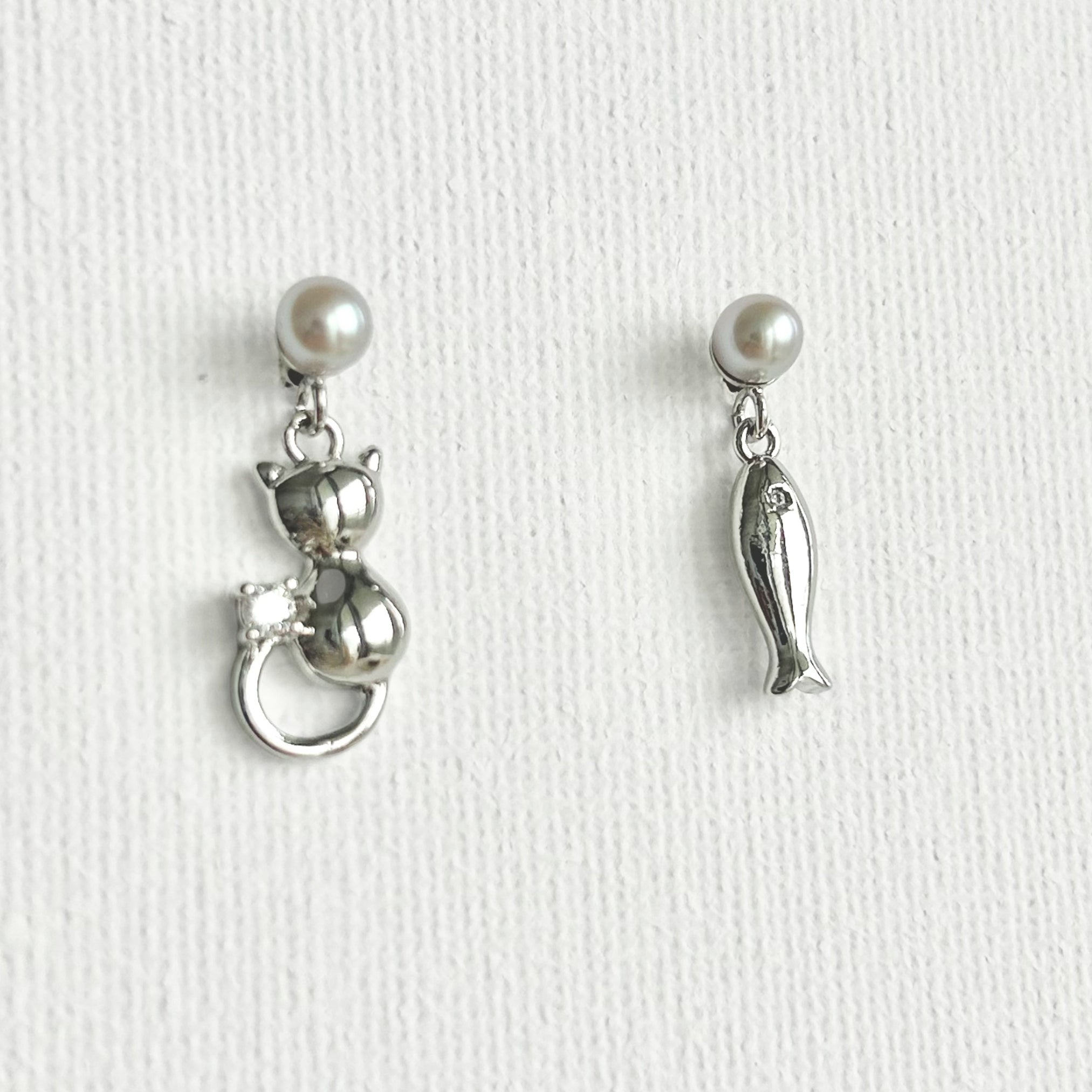 Natural Pearl Fish & Cat Stud Earrings featuring natural pearl and gold-plated brass, silver ear pins by Toronto-based Meng Jewellery