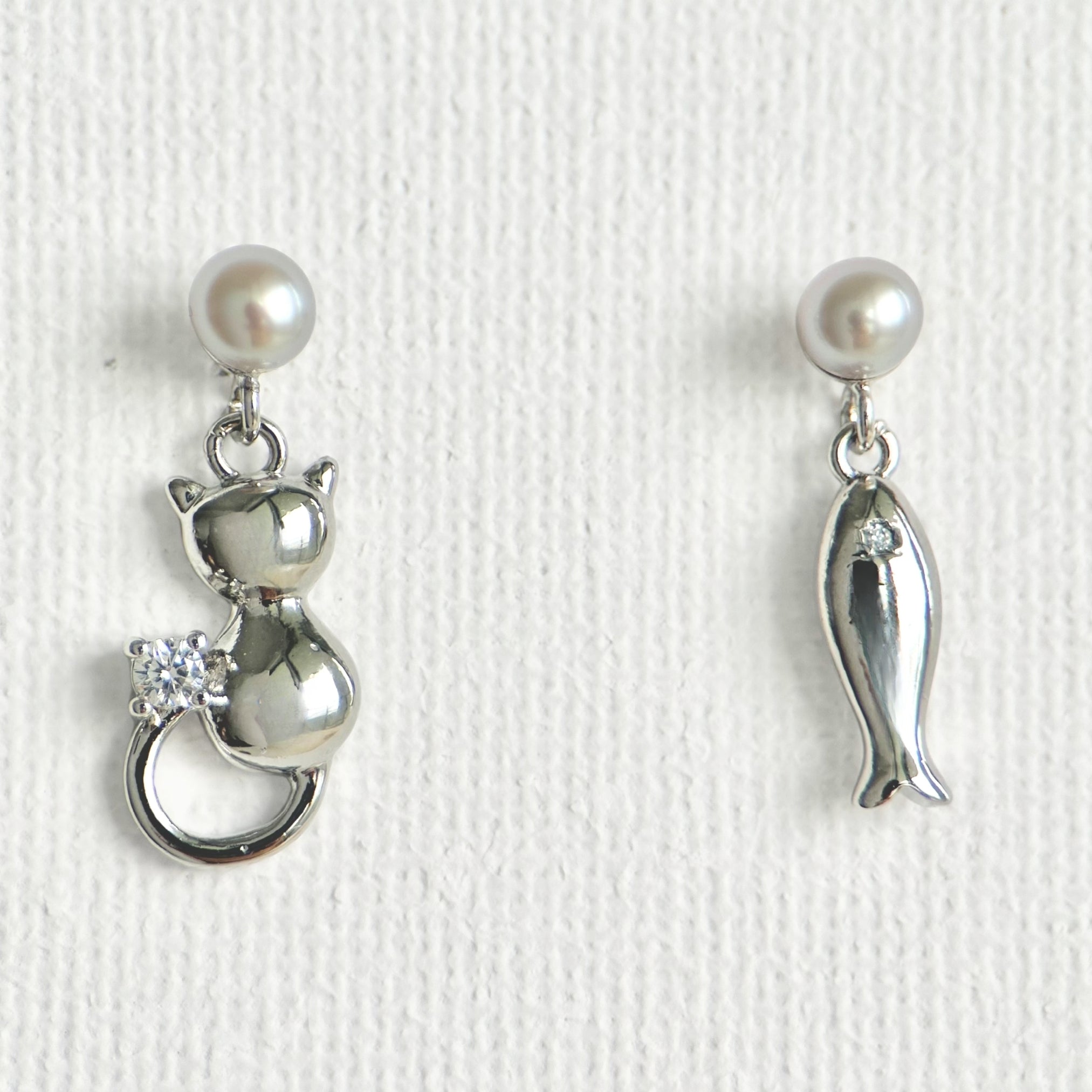 Natural Pearl Fish & Cat Stud Earrings featuring natural pearl and gold-plated brass, silver ear pins by Toronto-based Meng Jewellery