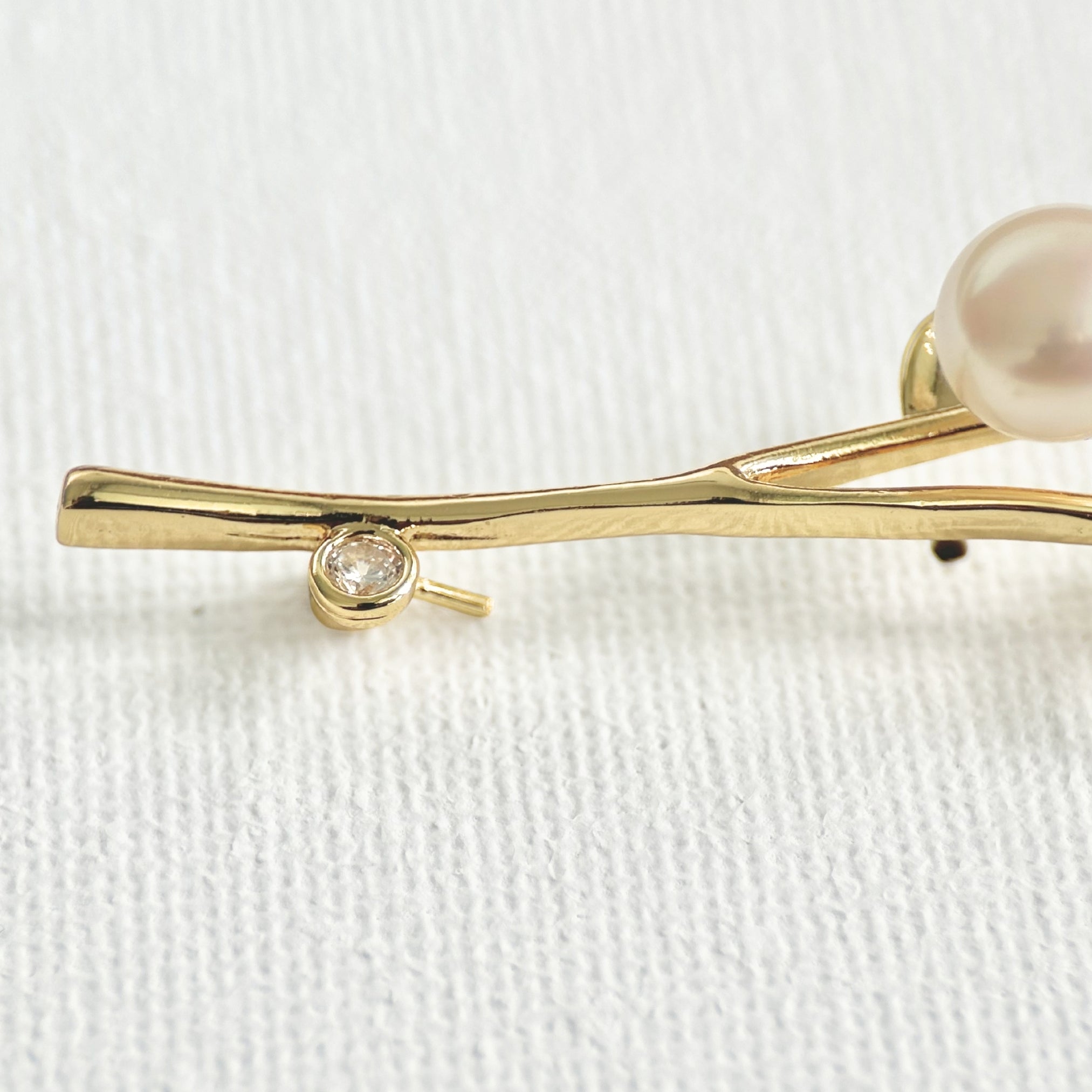 Freshwater Pearl Flower Brooch featuring natural pearl and gold-plated brass by Toronto-based Meng Jewellery