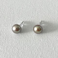 Peacock Color Oval Natural Pearl Studs in Sterling Silver featuring natural freshwater pearl and 925 sterling silver by Toronto-based Meng Jewellery