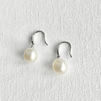 Natural Pearl Silver Hook Earrings featuring natural freshwater pearl, zircon and 925 sterling silver, gold-plated finish by Toronto-based Meng Jewellery