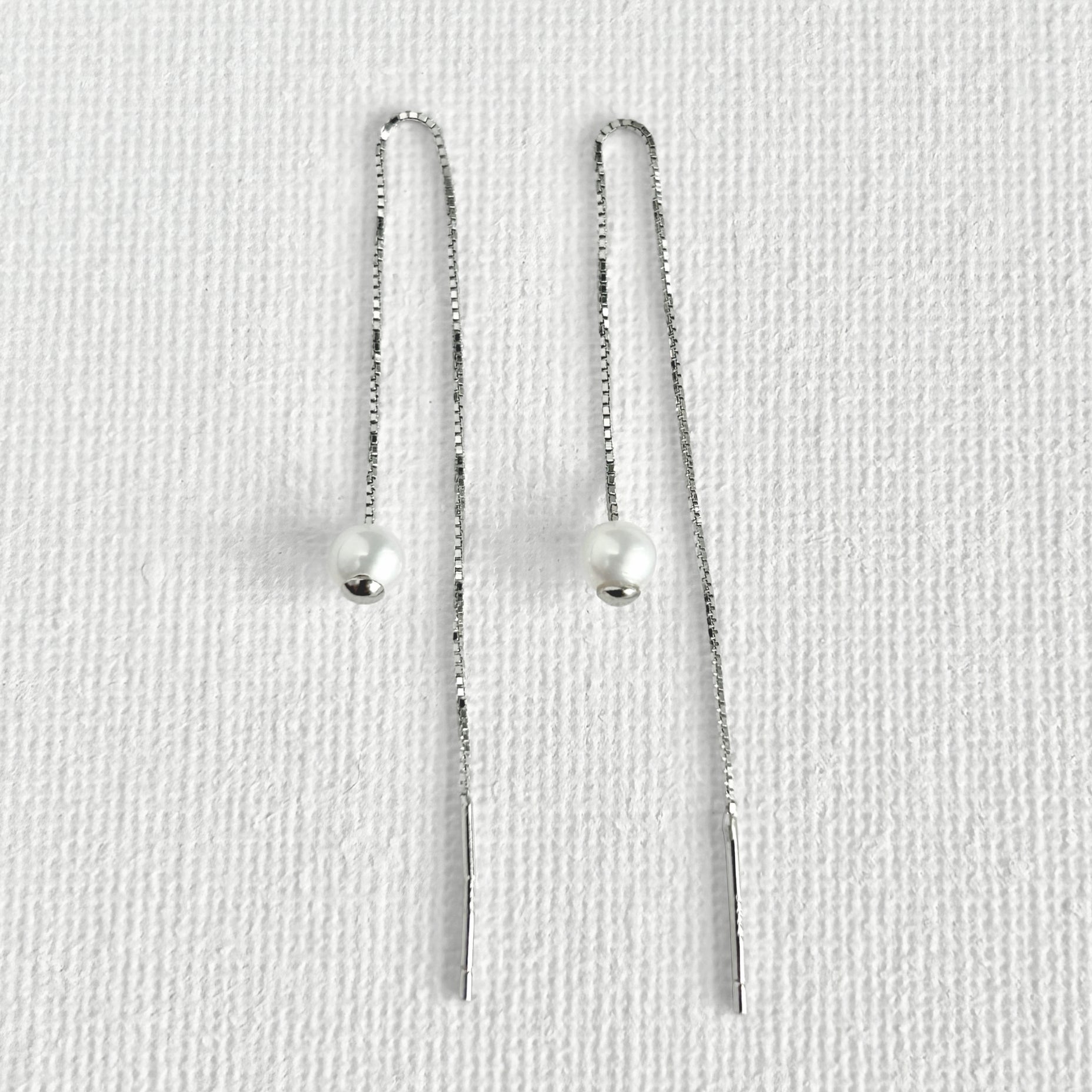Natural White Pearl Threader Earrings in Sterling Silver featuring natural freshwater pearl and 925 sterling silver by Toronto-based Meng Jewellery