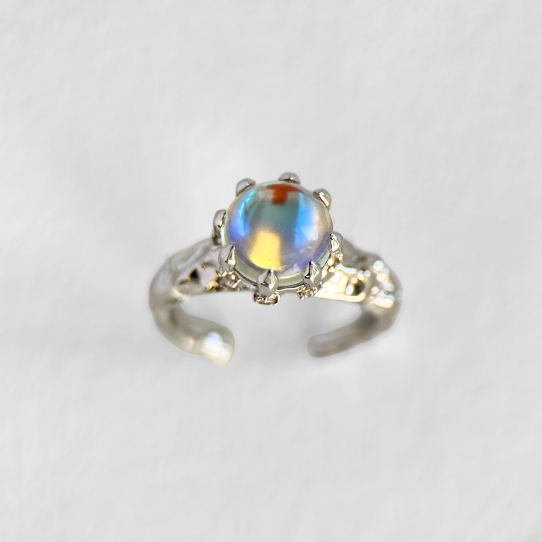 Mossborne opal ring with iridescent blue stone and adjustable silver band