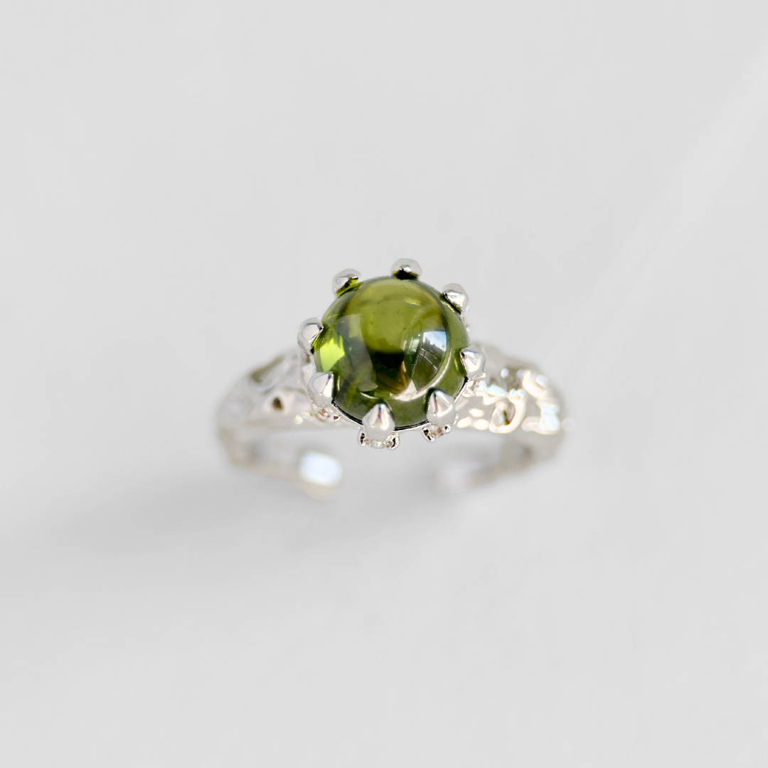 Adjustable silver ring with moss green stone and organic textured band